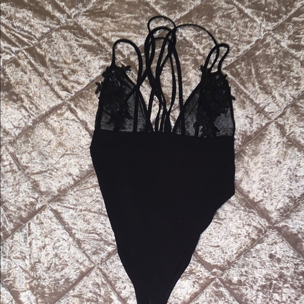 Black mesh and appliqué bodysuit